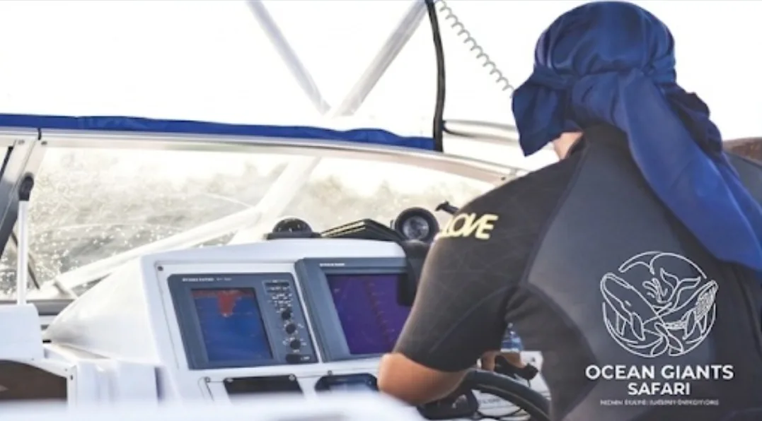 Over-the-shoulder view at the boat's helm, with echo sounder and chart plotter